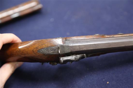 A pair of early 19th century percussion lock pistols, by Wogdon of London, 14in.